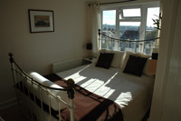 Bedroom with ensuite and wiews over Brighton towards the sea.